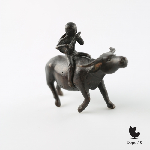 Traditional_Antique_Bronze_Asian_sculpture_of_a_boy_flute_player_riding_the_Bull_Home__Depot19_vintage_design_classics_7.jpeg
