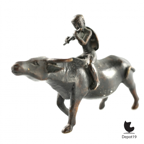 Traditional_Antique_Bronze_Asian_sculpture_of_a_boy_flute_player_riding_the_Bull_Home__Depot19_vintage_design_classics_0.jpeg